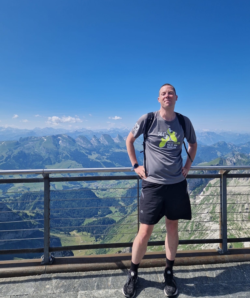 Vincent with a mountain landscape in the background.